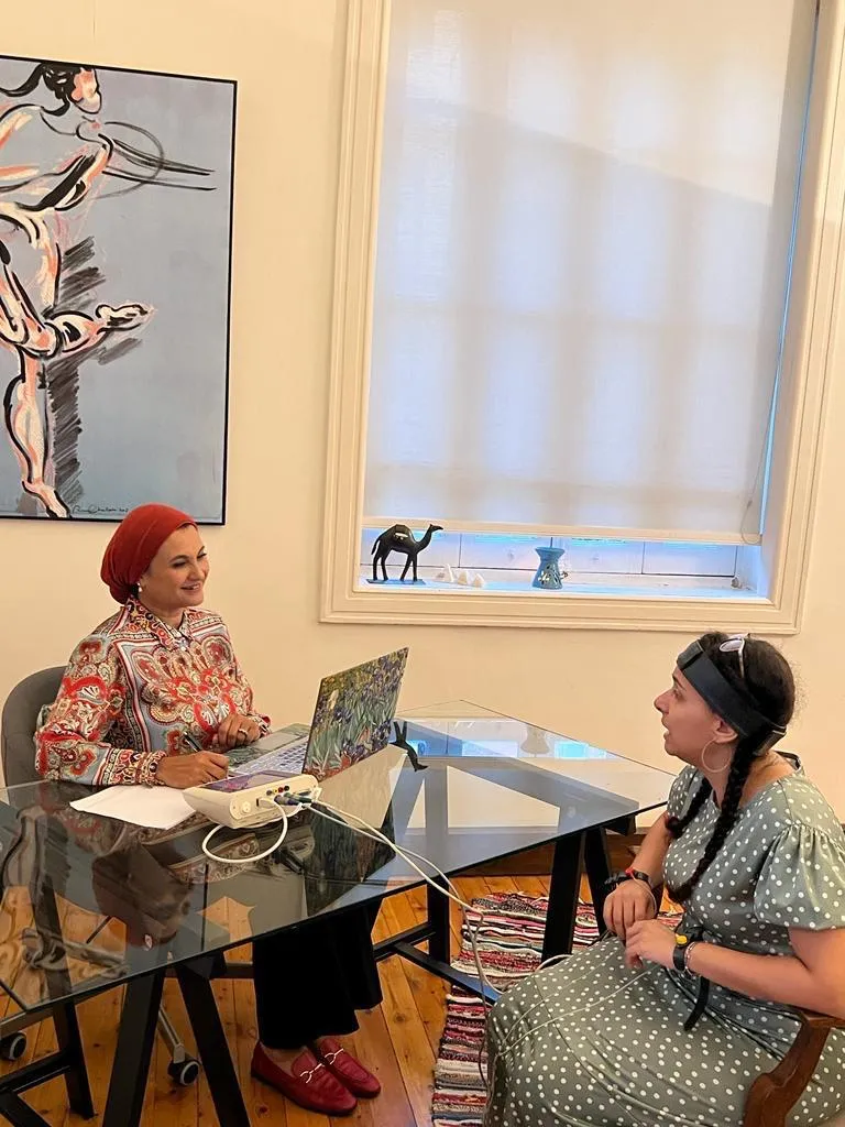 Dr. Heba in a session with a client